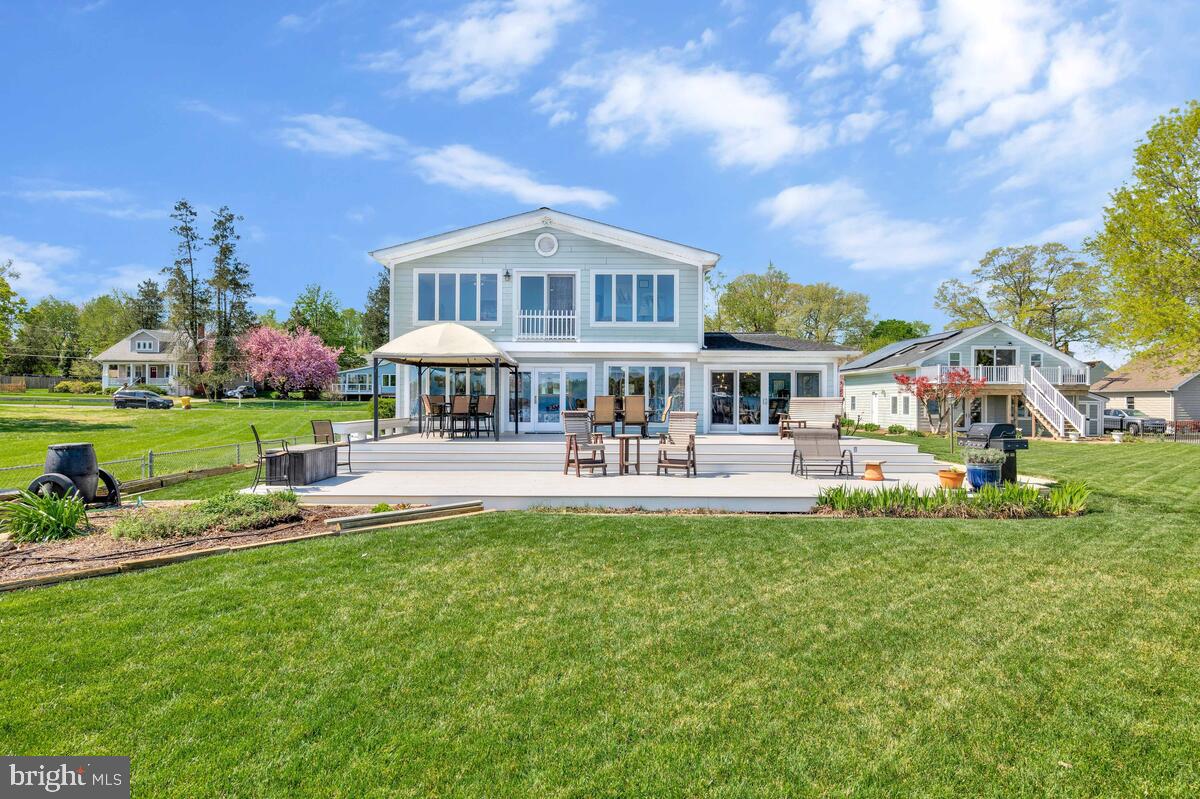 201 Edgewater Drive Edgewater, MD 21037 - Photo 37 of 49 a front view of a house with swimming pool and green space