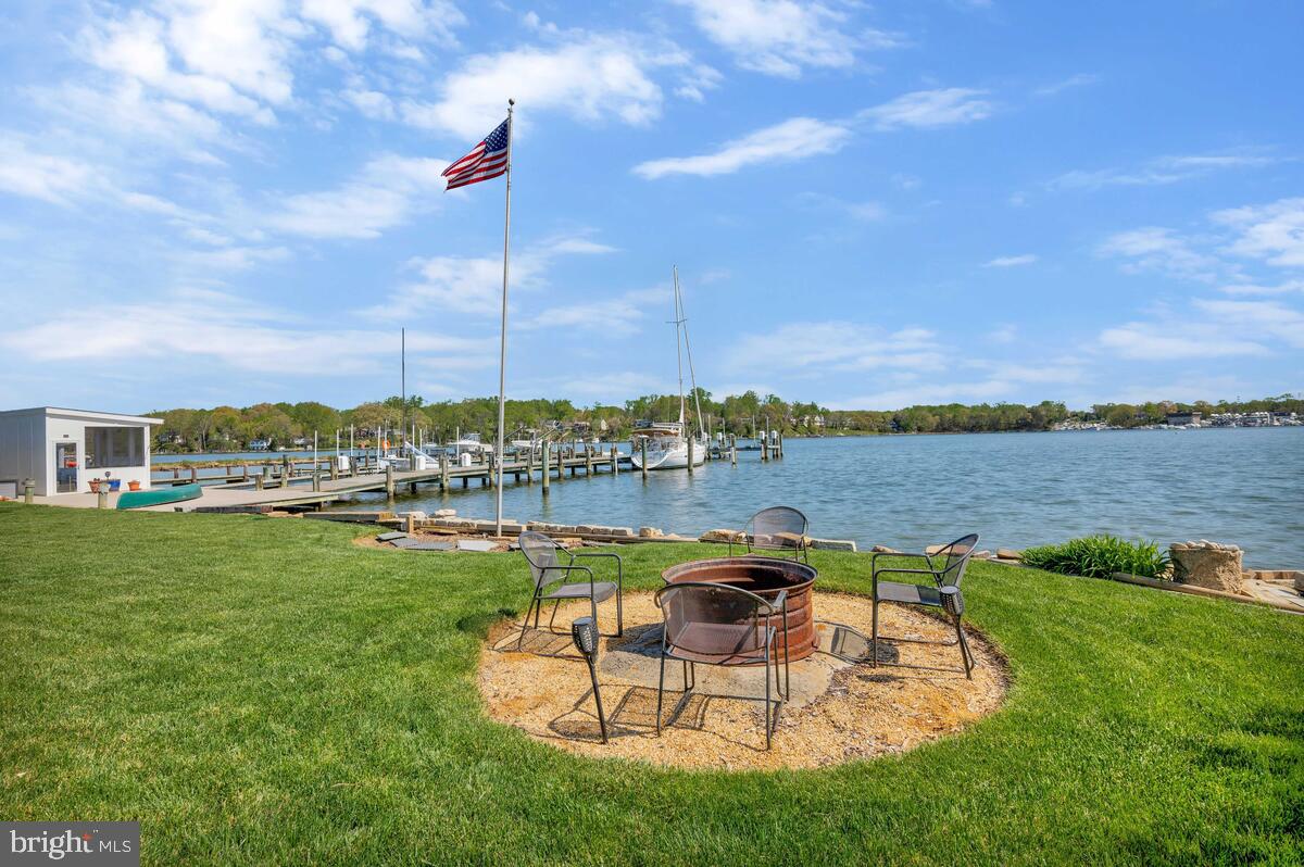201 Edgewater Drive Edgewater, MD 21037 - Photo 38 of 49 a view of a lake with couches and city view