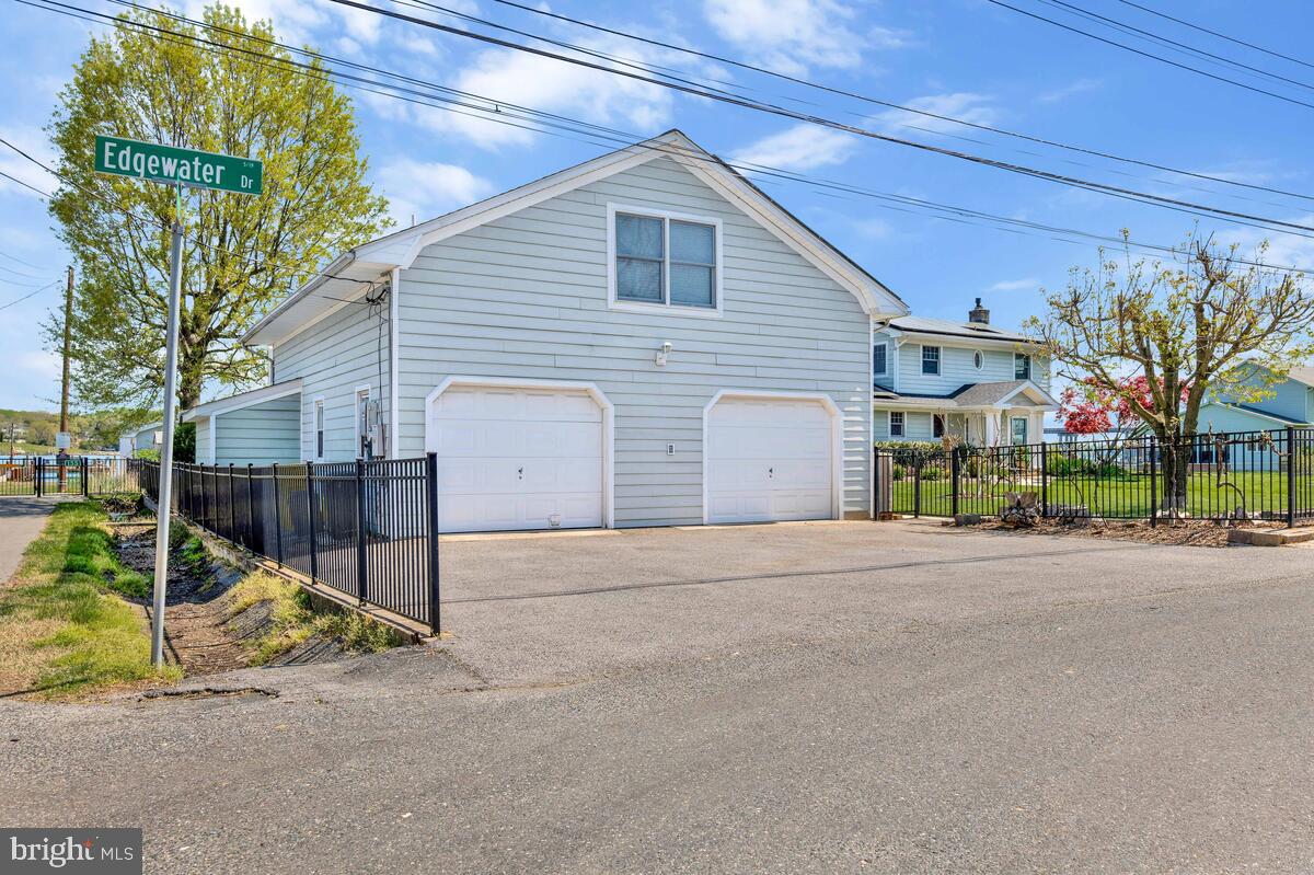 201 Edgewater Drive Edgewater, MD 21037 - Photo 42 of 49 a view of a house with a yard and garage