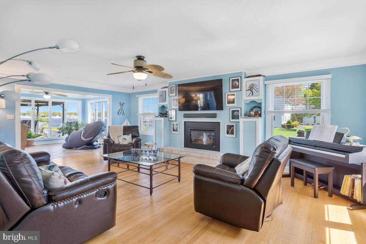 201 Edgewater Drive Edgewater, MD 21037 - Photo 7 of 49 a living room with furniture a fireplace and a flat screen tv