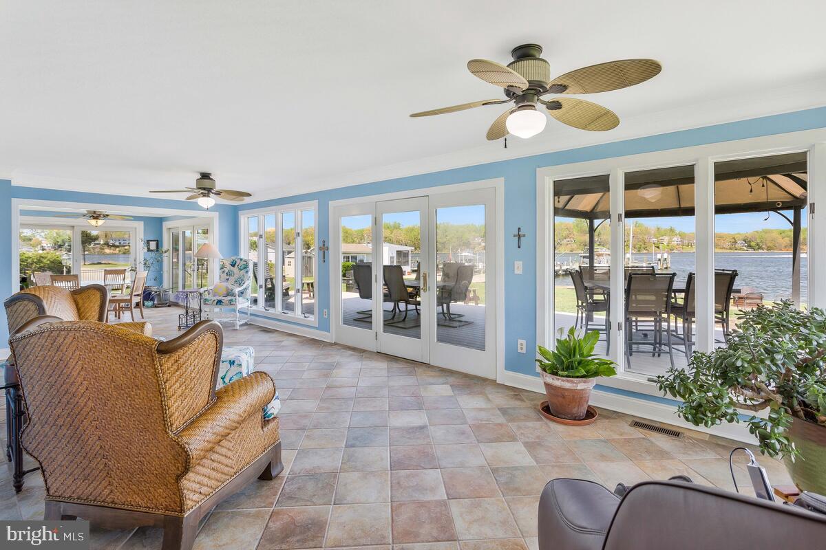 201 Edgewater Drive Edgewater, MD 21037 - Photo 10 of 49 a living room with furniture and a large window with garden view