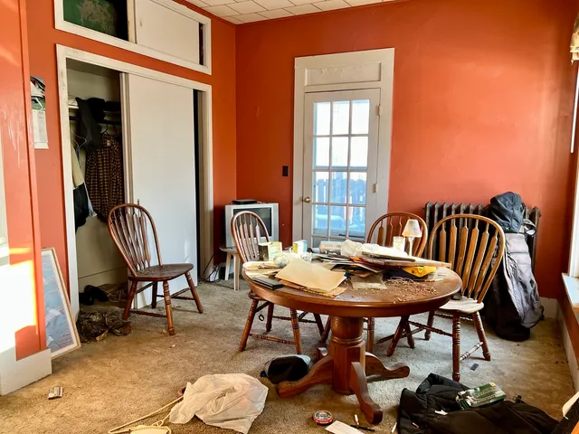a view of a dining room with furniture and chandelier