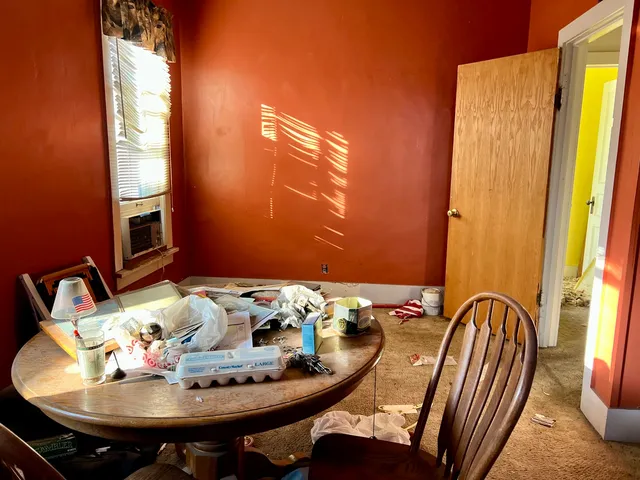 a view of a dining room with furniture window and outside view