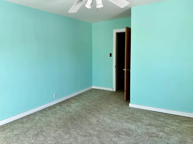 a room with a bed and a window