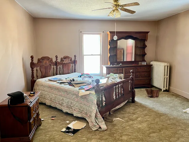 a room with a bed and a window