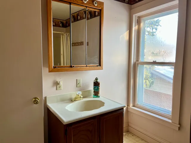 a bathroom with a shower and a tub