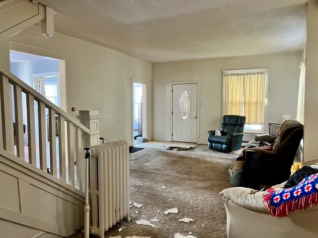 a living room with furniture floor and a window