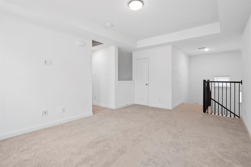 1801 Eagle Landing Van Alstyne, TX 75495 - Photo 12 of 27 Carpeted spare room with baseboards and a tray ceiling
