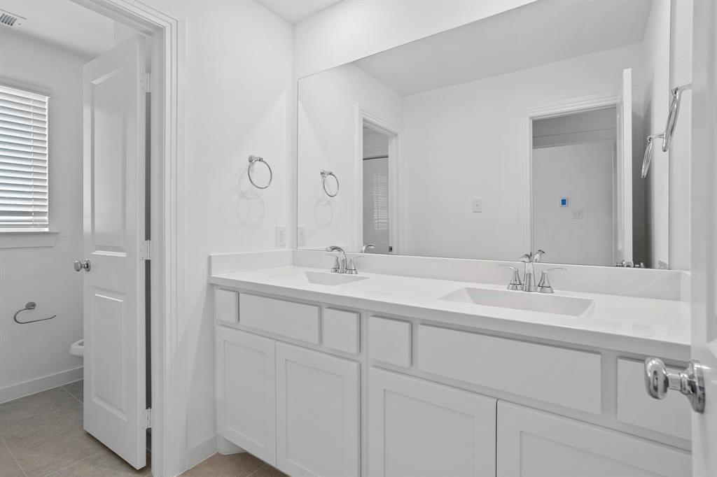 1801 Eagle Landing Van Alstyne, TX 75495 - Photo 7 of 27 Full bathroom featuring double vanity and tile patterned floors