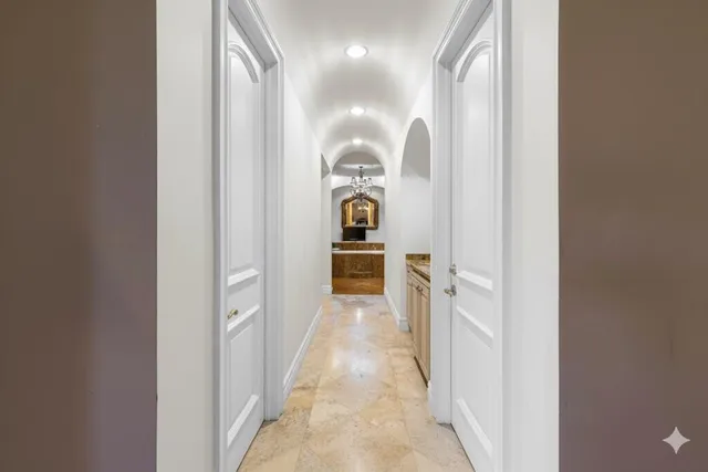 a bathroom with a granite countertop tub a mirror and a shower