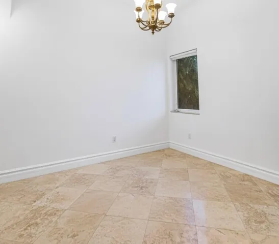 an empty room with closet area