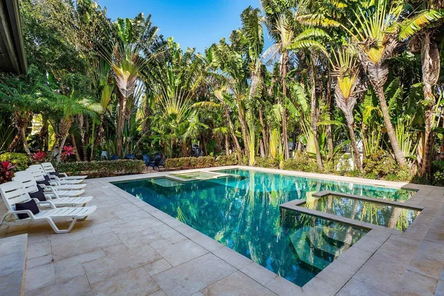 a kitchen with a stove and white cabinets