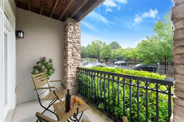 a view of a balcony with wooden floor
