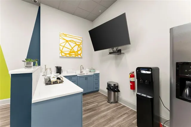 a kitchen with a appliances and cabinets