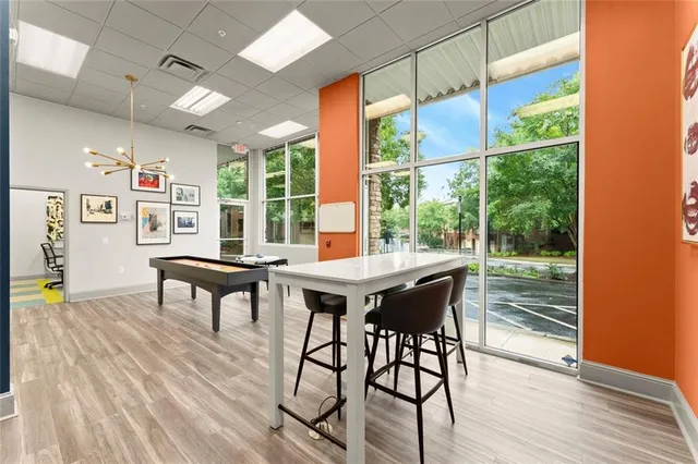 a view of a dining room with furniture window and wooden floor
