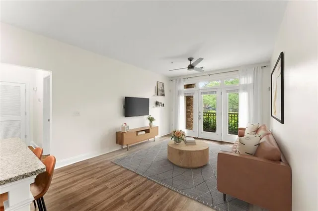 a living room with furniture and a flat screen tv