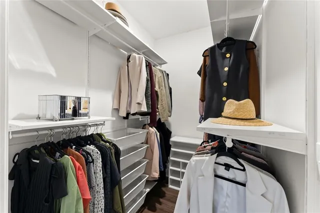 a bedroom with a bed and a closet