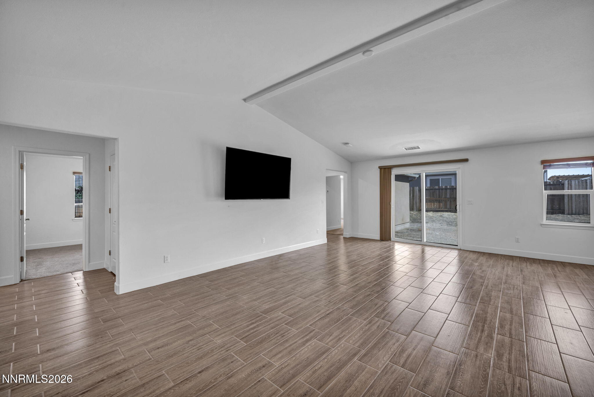 7181 Saddlehorn Road Carson City, NV 89701 - Photo 6 of 62 a view of a livingroom with wooden floor