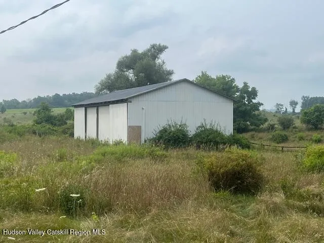 a brick building with a yard