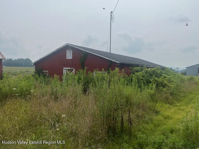 1820 Co Rte 7 Ancram, NY 12502 - Photo 21 of 32 a front view of a house with a yard