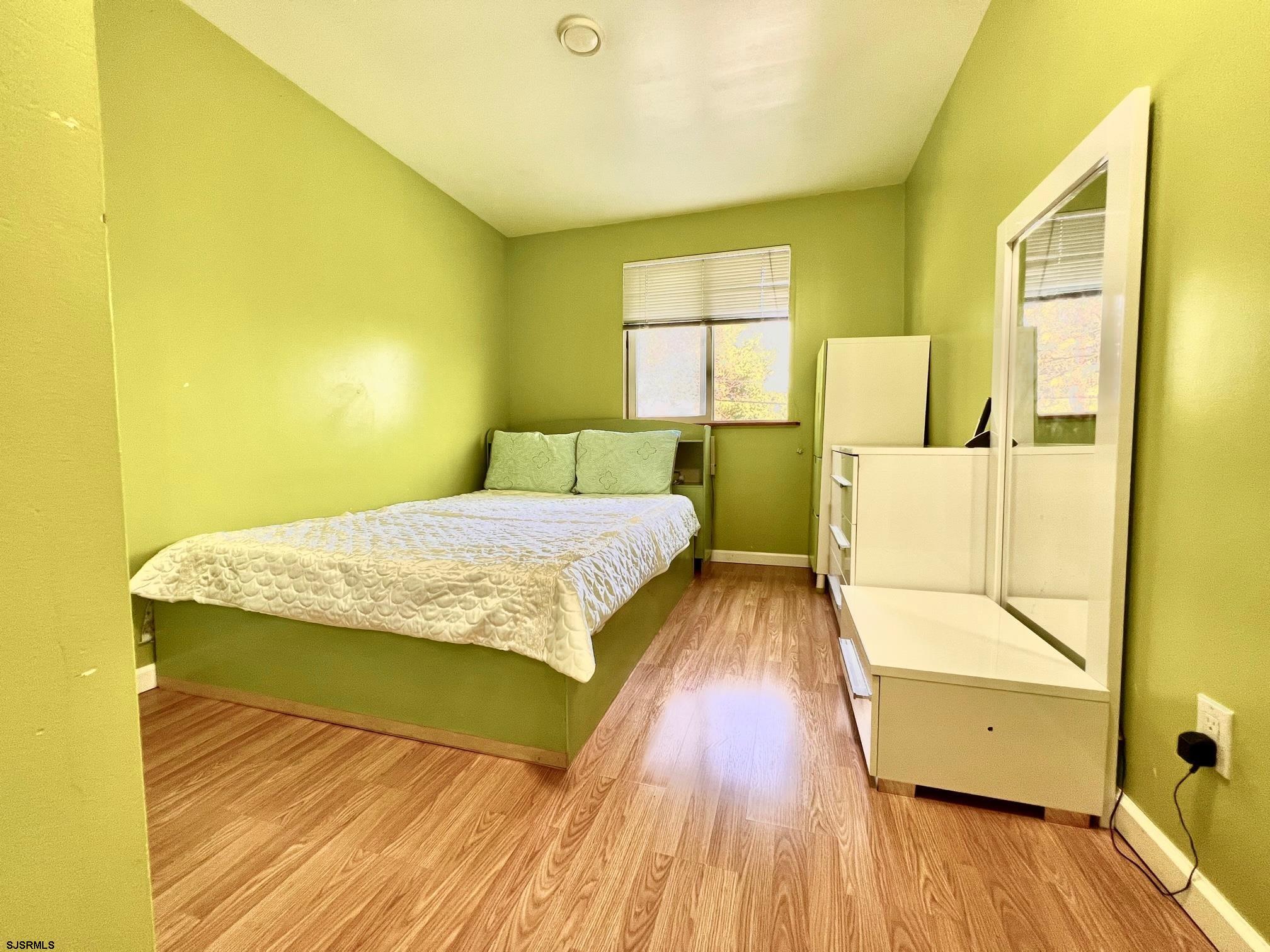 19 Walnut Lane Clementon, NJ 08021 - Photo 11 of 24 a bedroom with a bed and wooden floor