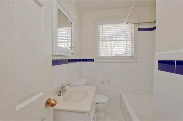 a bath room with a sink and a bath tub