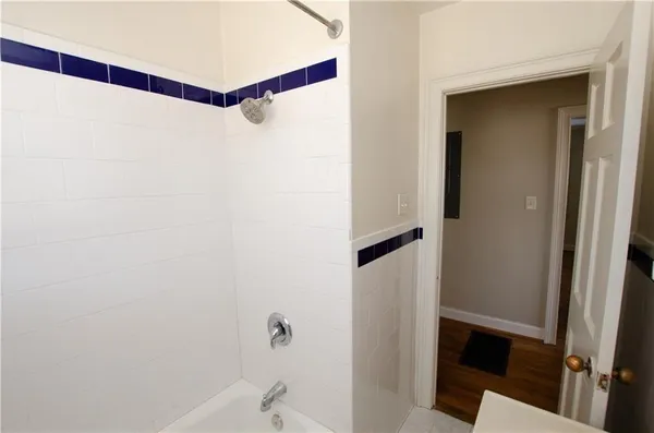 a bathroom with a shower and a shower