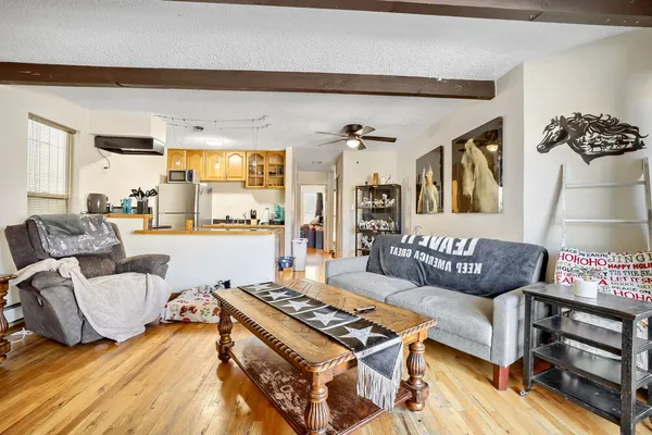 a living room with furniture and a table