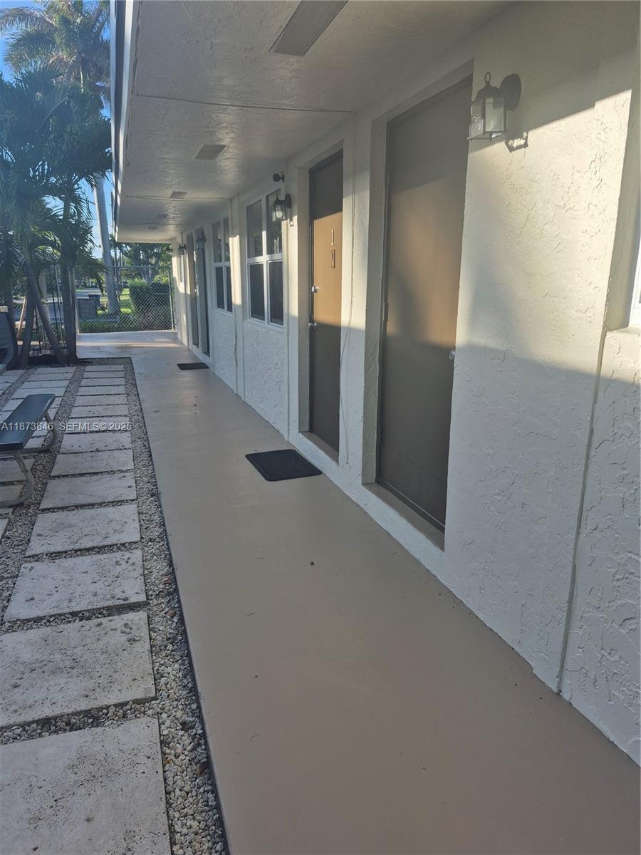 216 Southwest 9th Street, Unit 2 Hallandale Beach, FL 33009 - Photo 11 of 19 a view of a porch