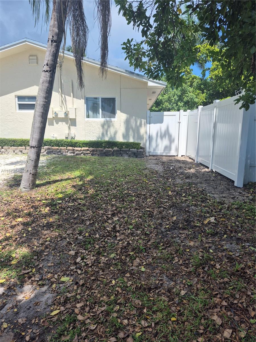 216 Southwest 9th Street, Unit 2 Hallandale Beach, FL 33009 - Photo 15 of 19 a view of a house with a yard