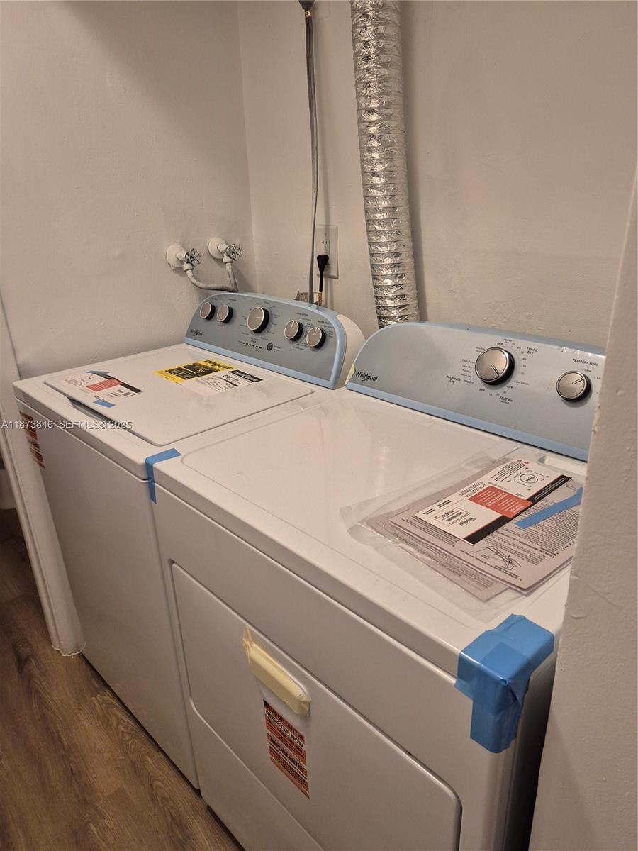 216 Southwest 9th Street, Unit 2 Hallandale Beach, FL 33009 - Photo 17 of 19 a utility room with dryer and washer