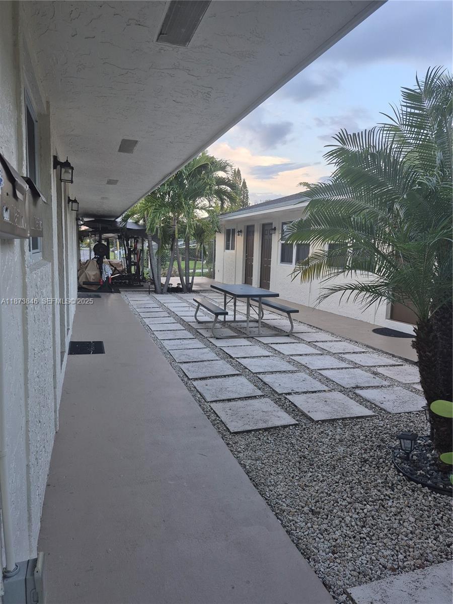 216 Southwest 9th Street, Unit 2 Hallandale Beach, FL 33009 - Photo 3 of 19 a view of a house with a patio