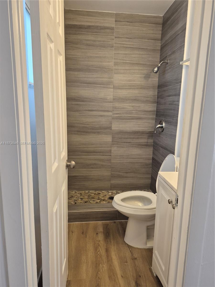 216 Southwest 9th Street, Unit 2 Hallandale Beach, FL 33009 - Photo 4 of 19 a bathroom with a toilet and a shower