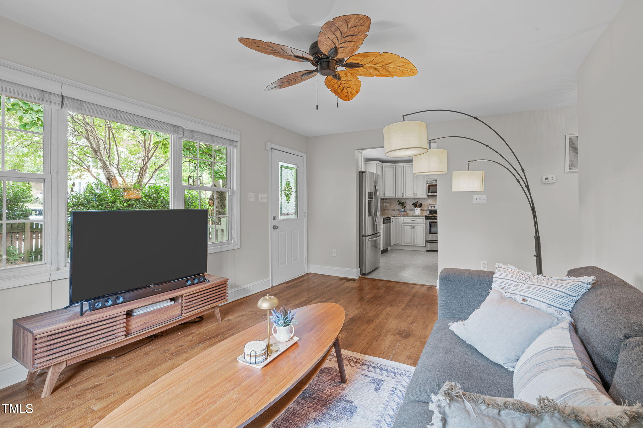 515 Freeman Street Raleigh, NC 27601 - Photo 15 of 44 a living room with furniture and a flat screen tv