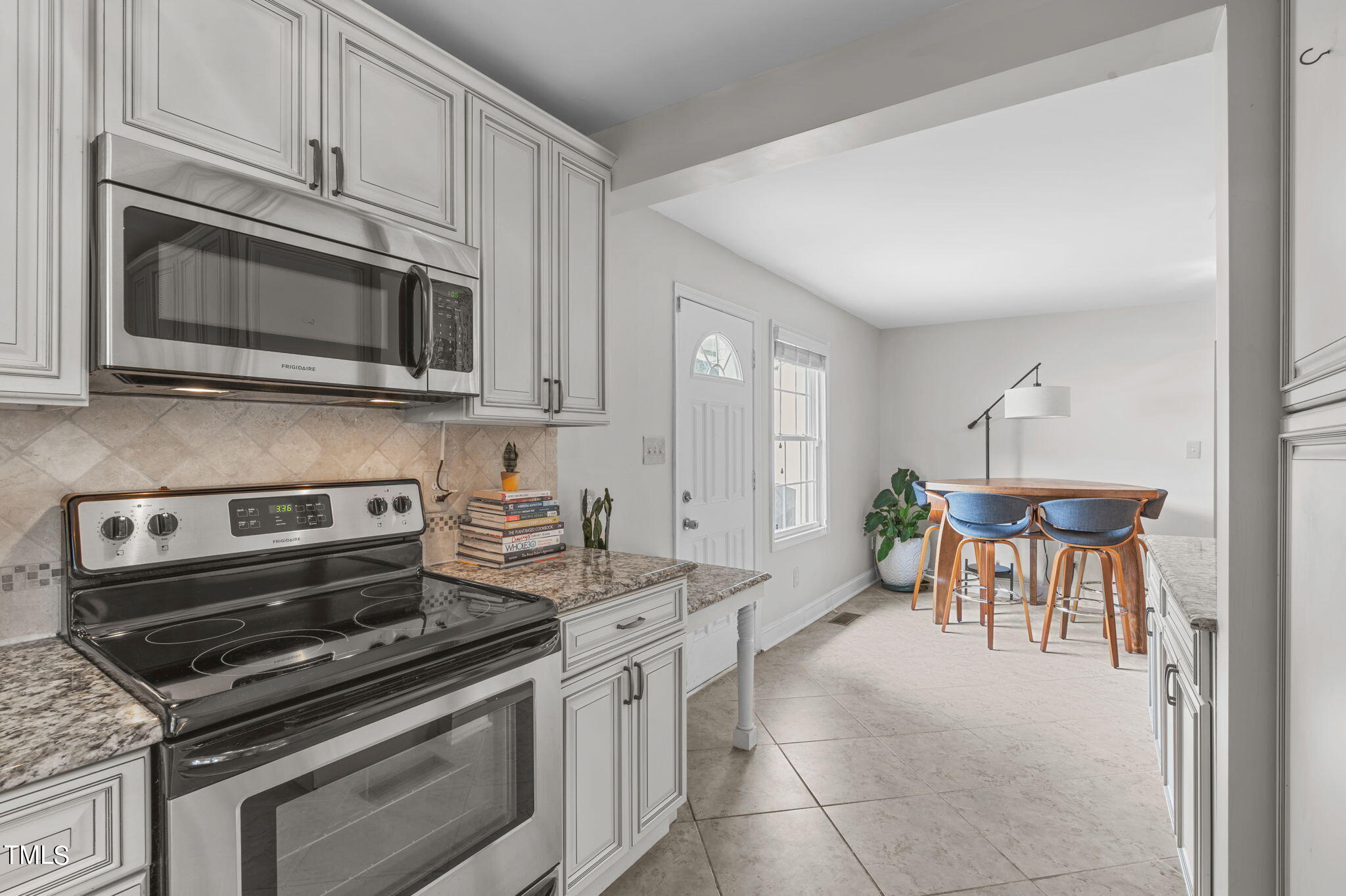 515 Freeman Street Raleigh, NC 27601 - Photo 18 of 44 a kitchen with a stove and a microwave