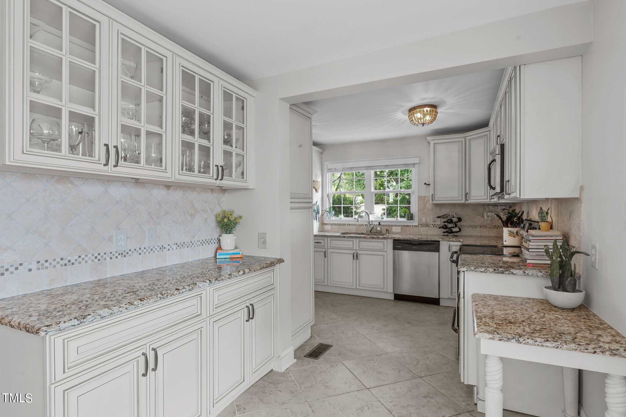 515 Freeman Street Raleigh, NC 27601 - Photo 21 of 44 a kitchen with a sink and cabinets