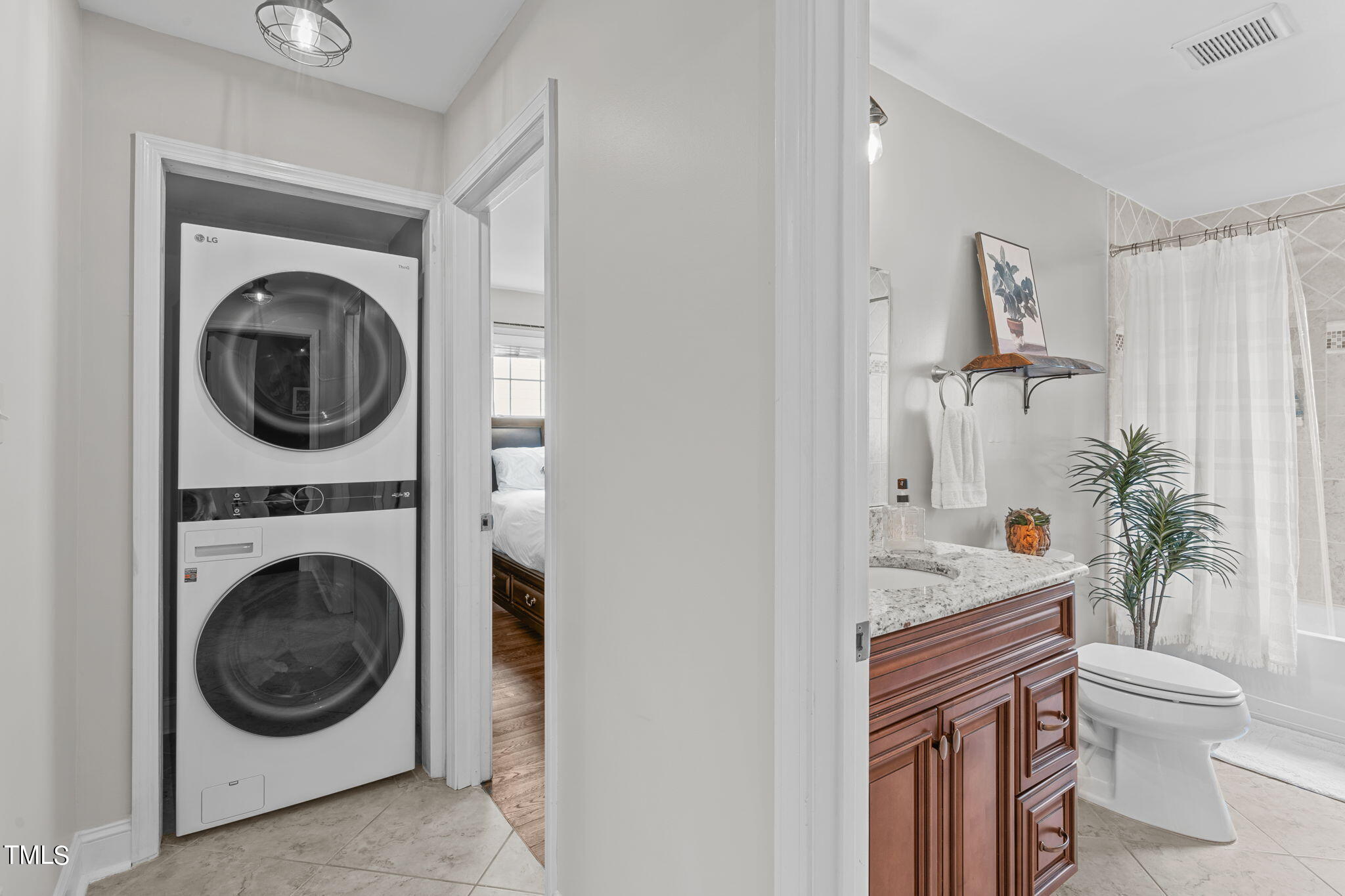 515 Freeman Street Raleigh, NC 27601 - Photo 25 of 44 a living room with a couch and a washer dryer
