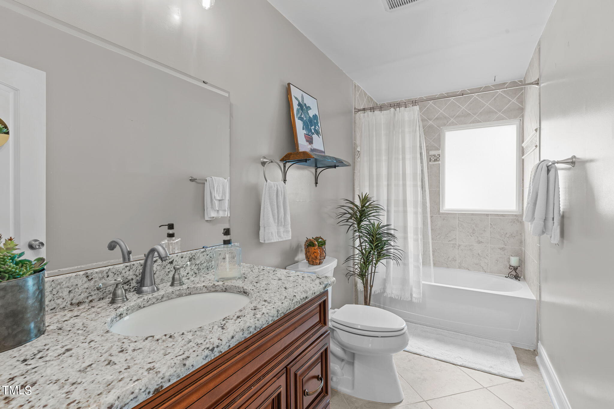515 Freeman Street Raleigh, NC 27601 - Photo 26 of 44 a bathroom with a granite countertop sink toilet and shower