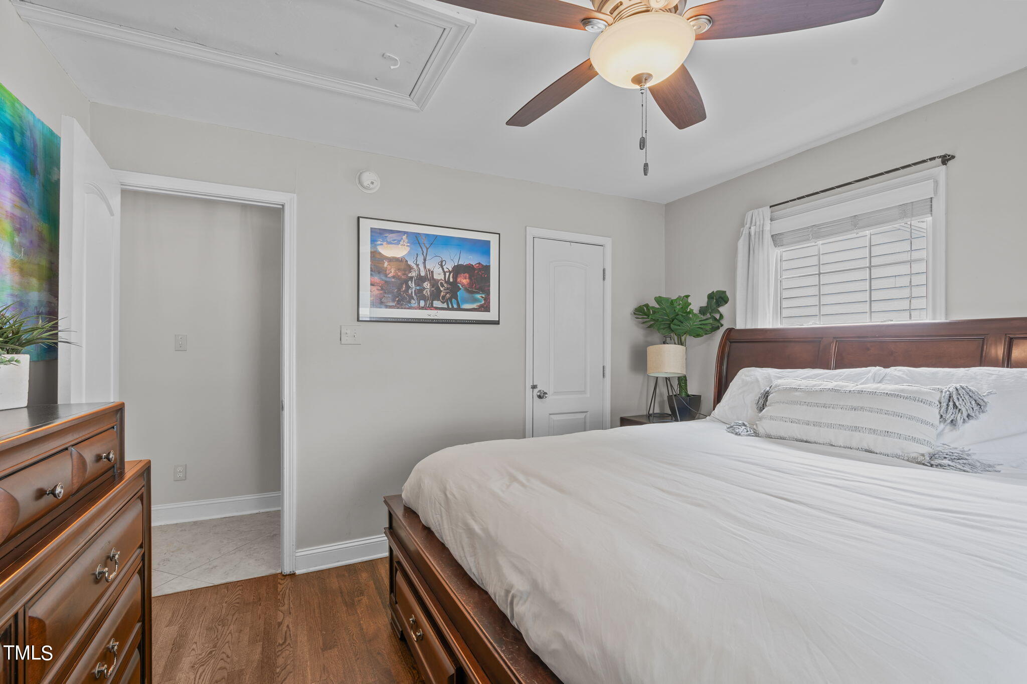 515 Freeman Street Raleigh, NC 27601 - Photo 28 of 44 a bedroom with a bed and a dresser with wooden floor