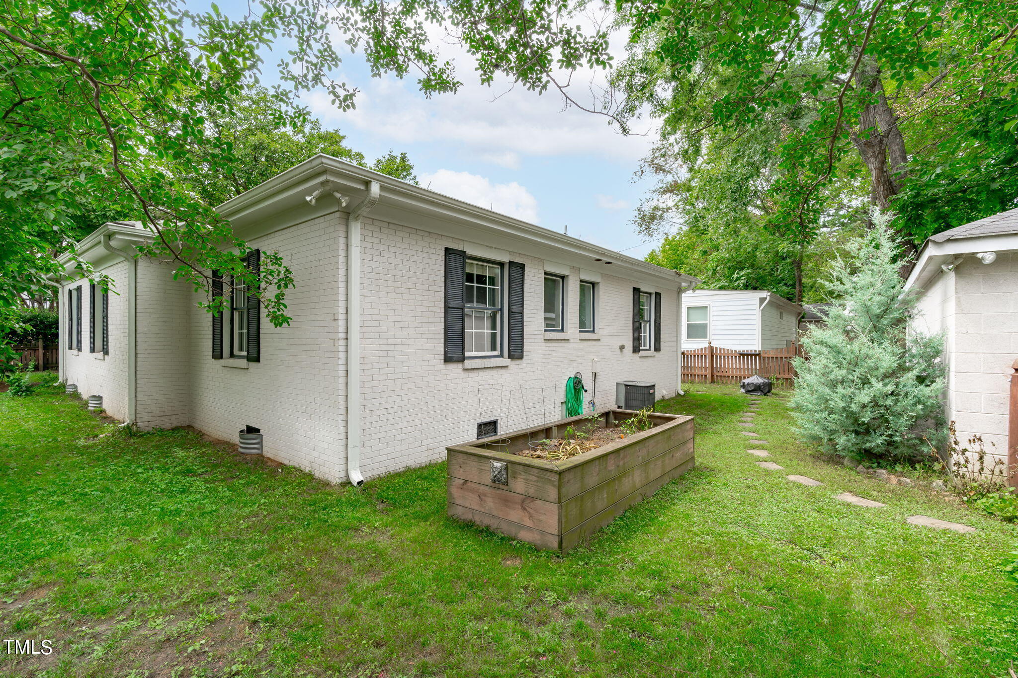 515 Freeman Street Raleigh, NC 27601 - Photo 32 of 44 a front view of house with yard and trees