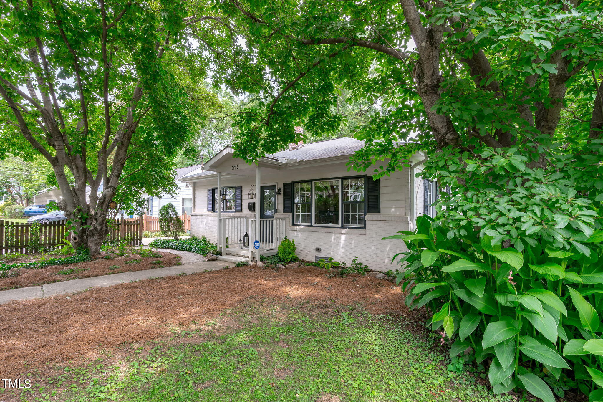 515 Freeman Street Raleigh, NC 27601 - Photo 4 of 44 a front view of a house with a garden