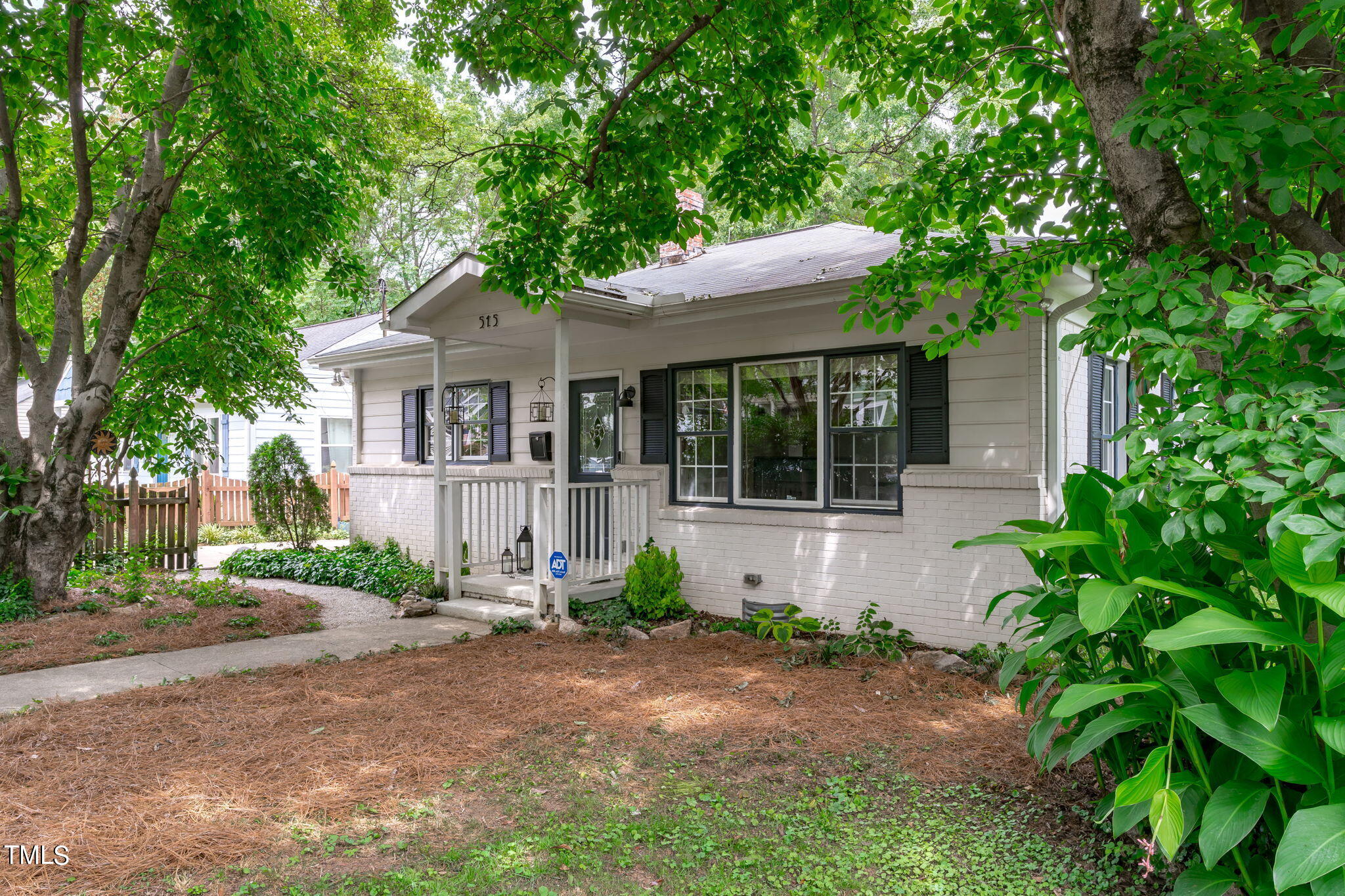 515 Freeman Street Raleigh, NC 27601 - Photo 5 of 44 a house with trees in the background