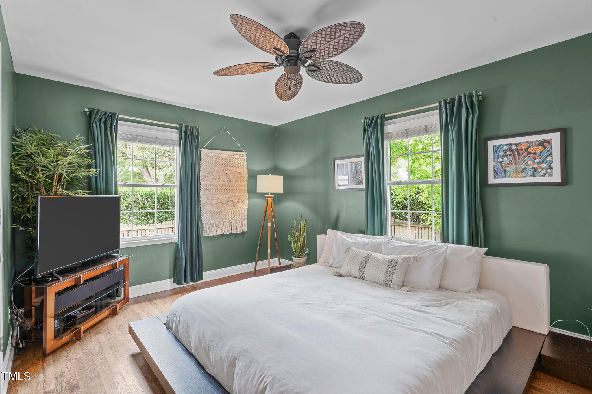 515 Freeman Street Raleigh, NC 27601 - Photo 6 of 44 a bedroom with a bed and a flat screen tv