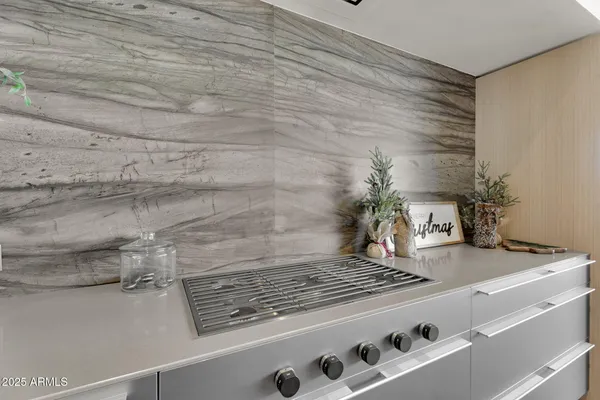 a stove top oven sitting inside of a kitchen
