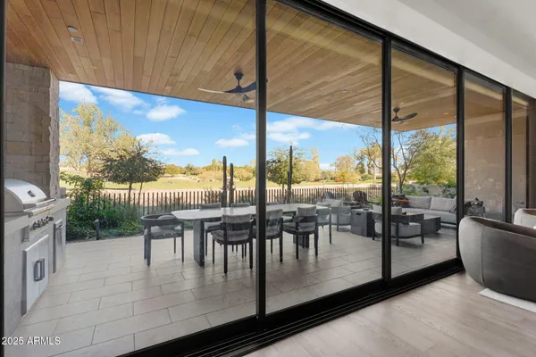 a dining room with wooden floor and city view