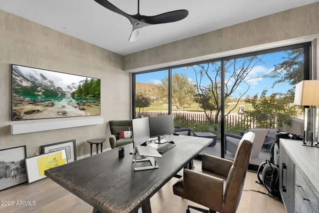 a view of a dining room with furniture large windows and wooden floor