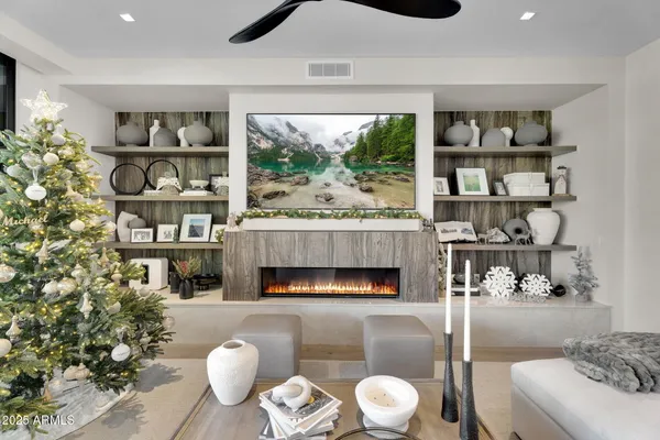 a living room with furniture and a fireplace