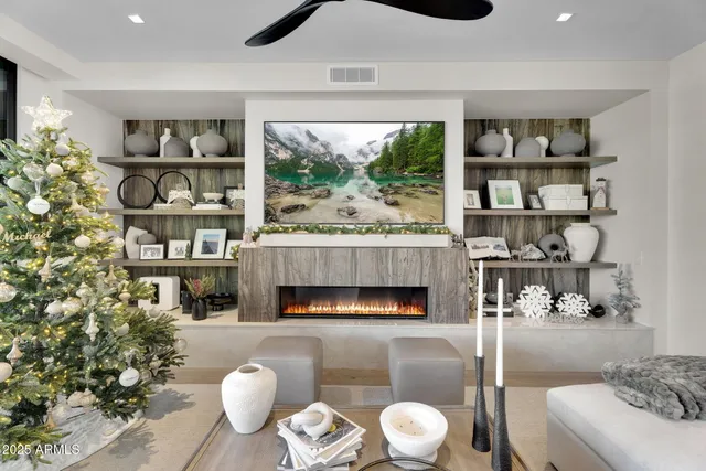 a living room with furniture and a fireplace