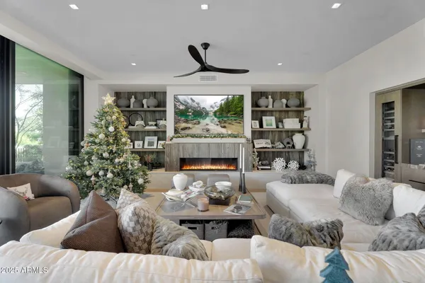 a living room with furniture and a large window