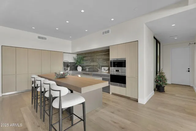 a kitchen with a table and chairs in it